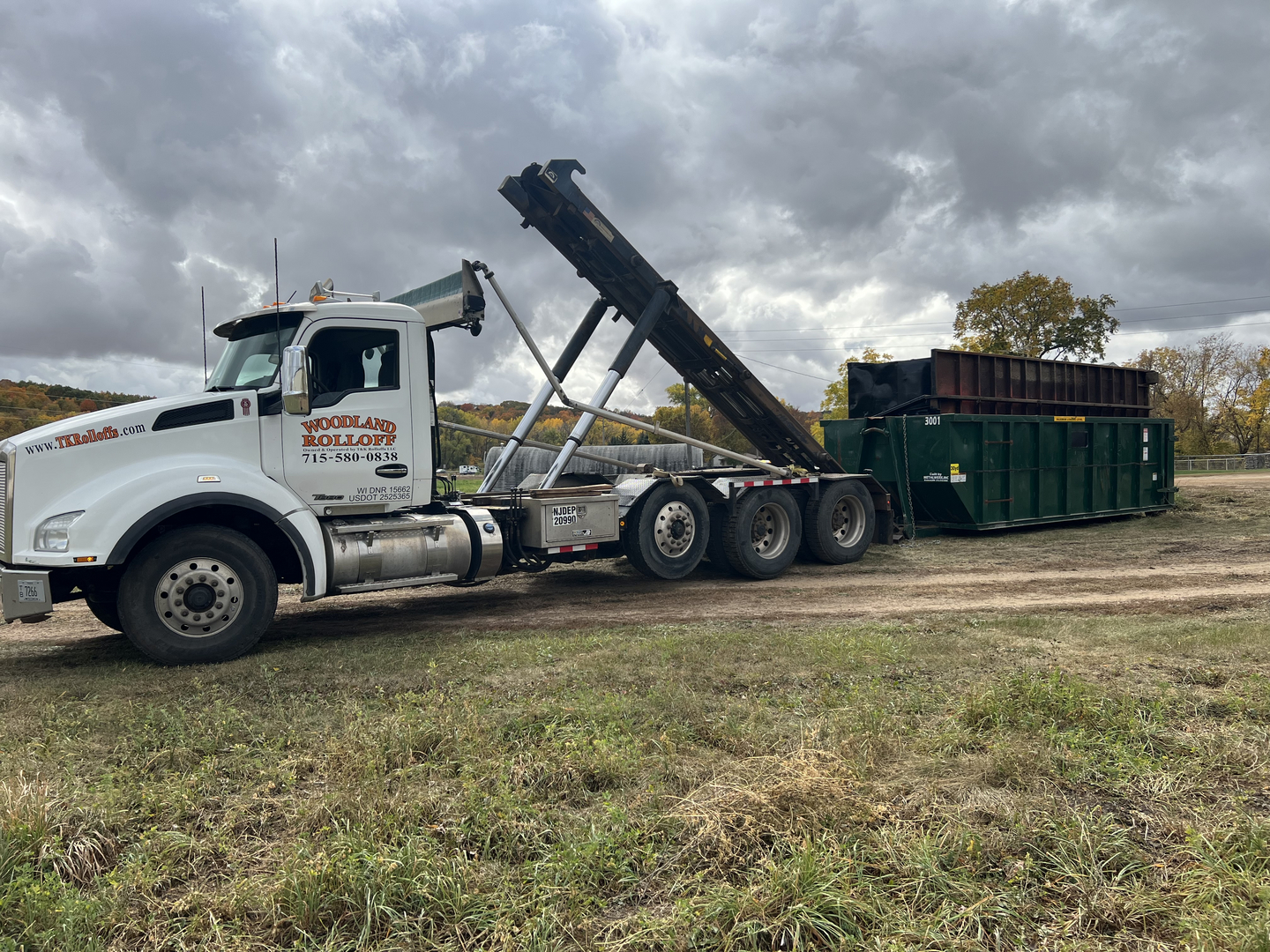 Woodland Rolloff white Kenworth truck with large dumpster