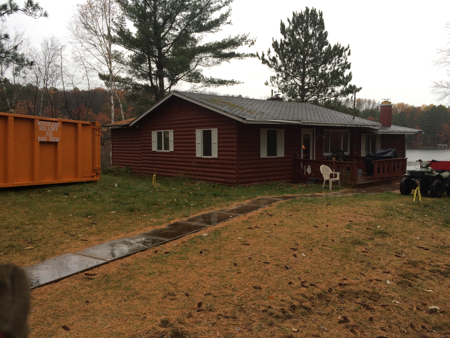 Woodland Rolloff dumpster at lakeside cabin cleanout