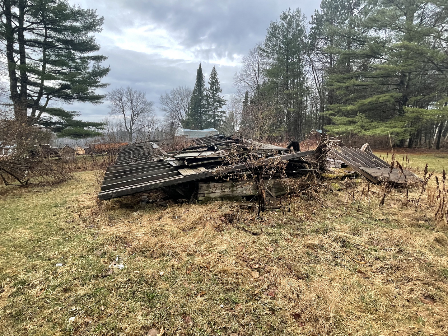 Collapsed structure and debris on property