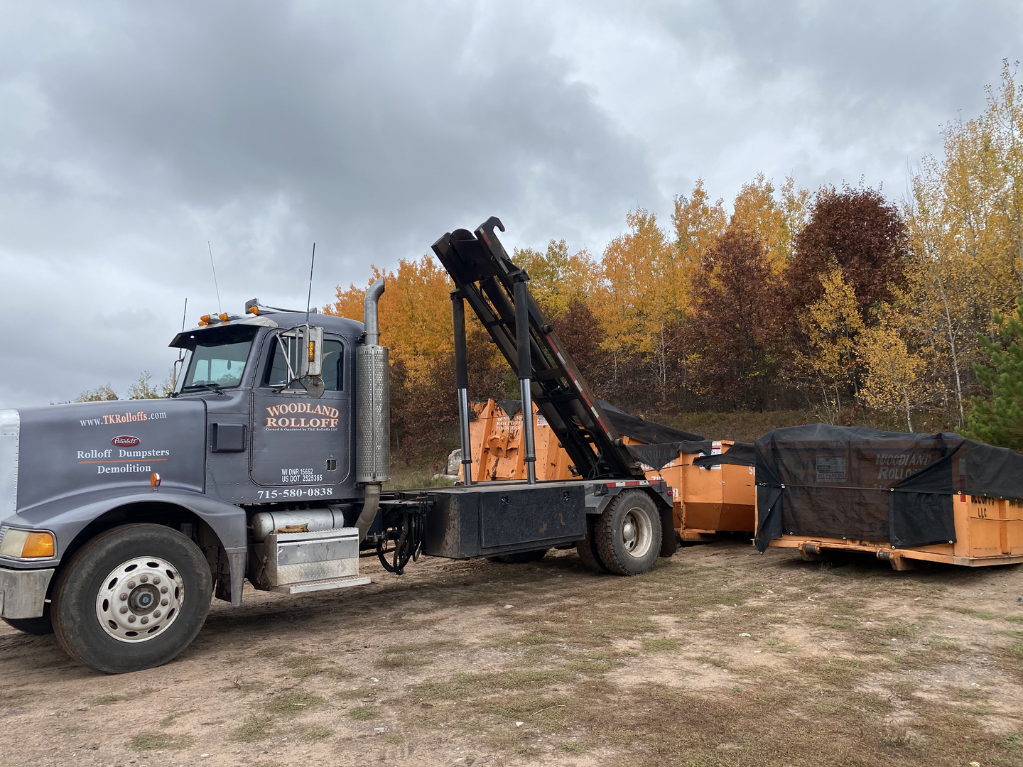 Woodland Rolloff Peterbilt truck with covered dumpsters